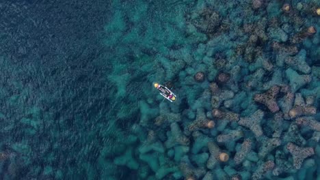 a-small-boat-that-paddles-through-shallow-sea