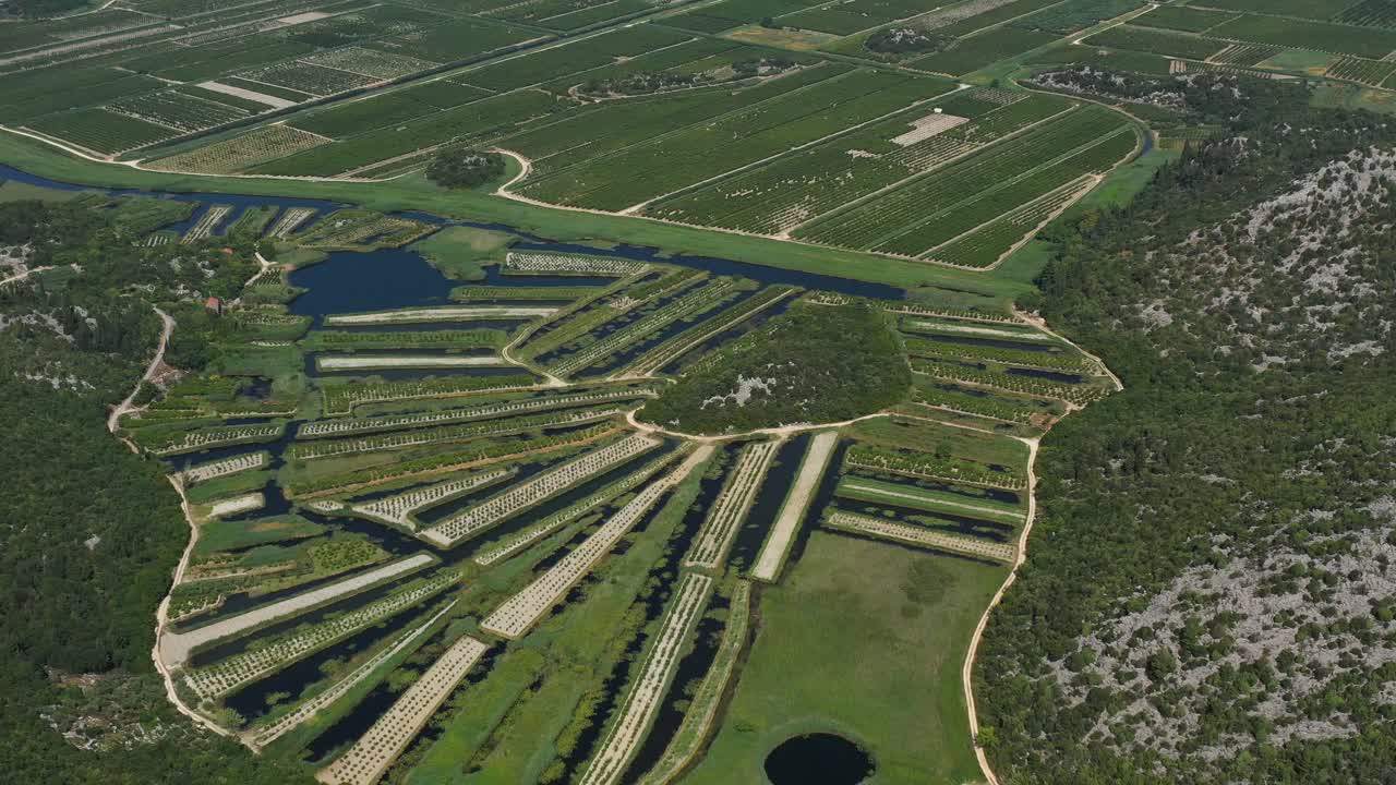 Neretva Valley, flying over Agriculture Plantation Fields in Delta of River Neretva in South Croatia - Aerial Drone View