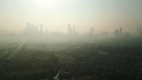 mumbai skyline covered in smog, extreme air pollution india, drone flyover aerial establishment shot