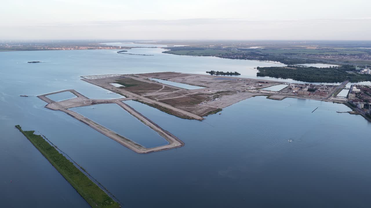 Middeneiland, Strandeiland, at Ijburg, Amsterdam, new build artificial island for residential purpose, still under construction. Aerial drone video.