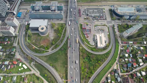 Aerial-shot-of-busy-traffic-road-bridge-crossing-the-Danube-river-in-Vienna