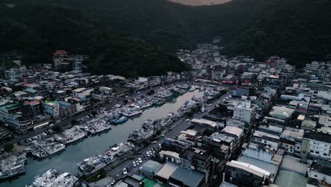 Nanfang&#039;ao Nanfangao Fishing Port Harbor at Sunset 南方澳漁港 Taiwan East Coast Yilan County, Aerial Drone Dolly, Fishing Town surrounded by Mountains