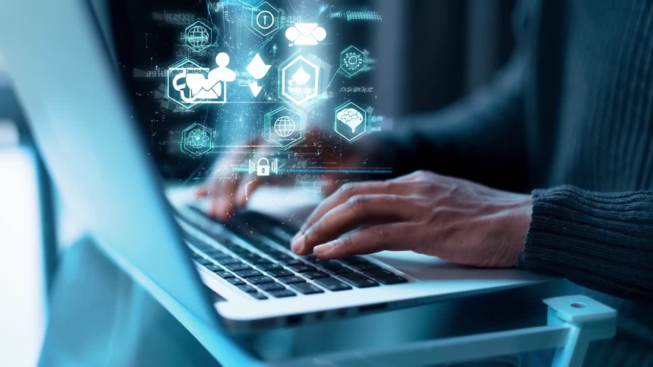 Close-up angle of hands typing on a laptop with digital icons overlay, concept of tech video