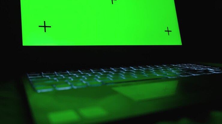 First-person view on a green screen. Man at home using laptop computer with green laptop screen, 4K shot