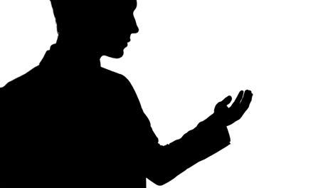 Shadow-of-a-Caucasian-man-holding-his-hand-for-a-copy-space-with-white-background