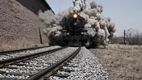powerful steam train with huge explosion of smoke