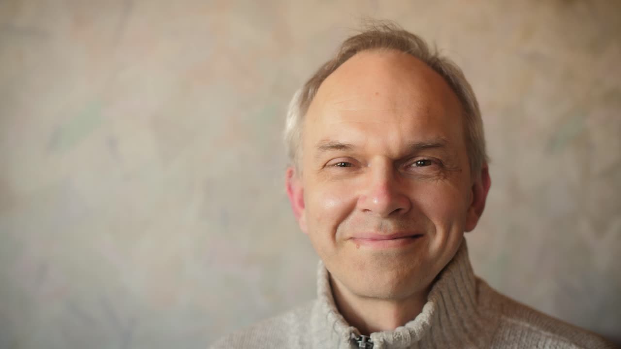 Portrait of mature man in protective black medical mask. 50year old man take off a face mask. End of pandemic, Coronavirus.