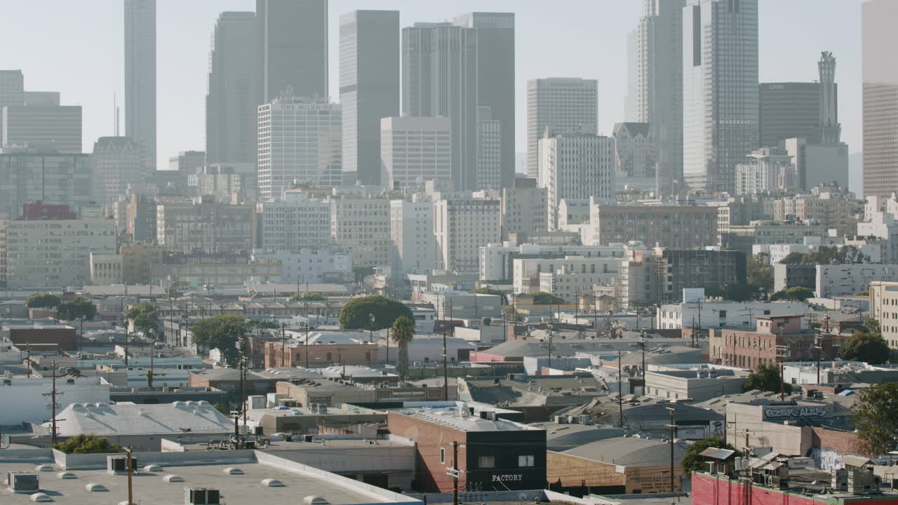 Aerial View of a Dense Cityscape with Skyscrapers and Rooftops