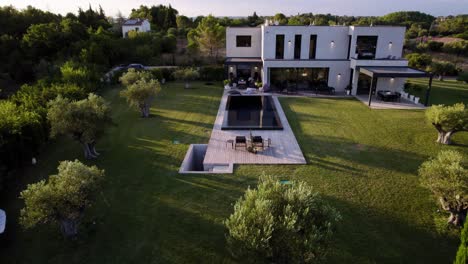 slow tilting shot of a luxury villa in the uzès countryside with a swimming pool