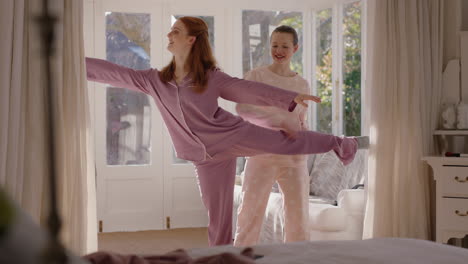 happy teenage girls practicing ballet dance moves in bedroom best friends having fun rehearsal on weekend morning wearing pajamas