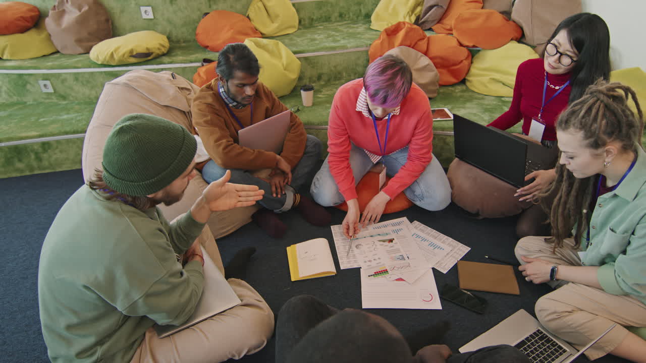Group of Diverse Colleagues Discussing Documents