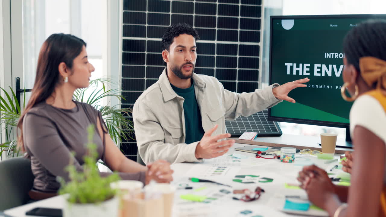 Diverse Business Team Discussing Presentation in Modern Office