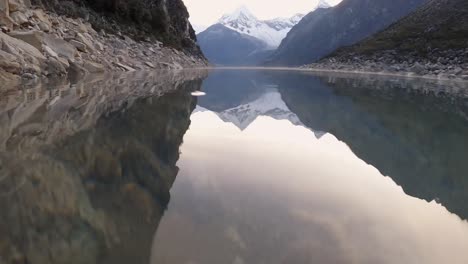 water reflection, paron lake, underwater view, andes mountain range, peru andean cordillera, andes granite under turquoise lagoon