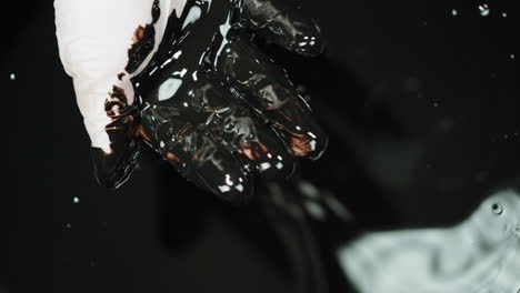 contaminated hand in oil