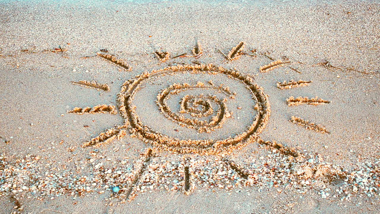 Sun drawing on the beach. Beach and drawing