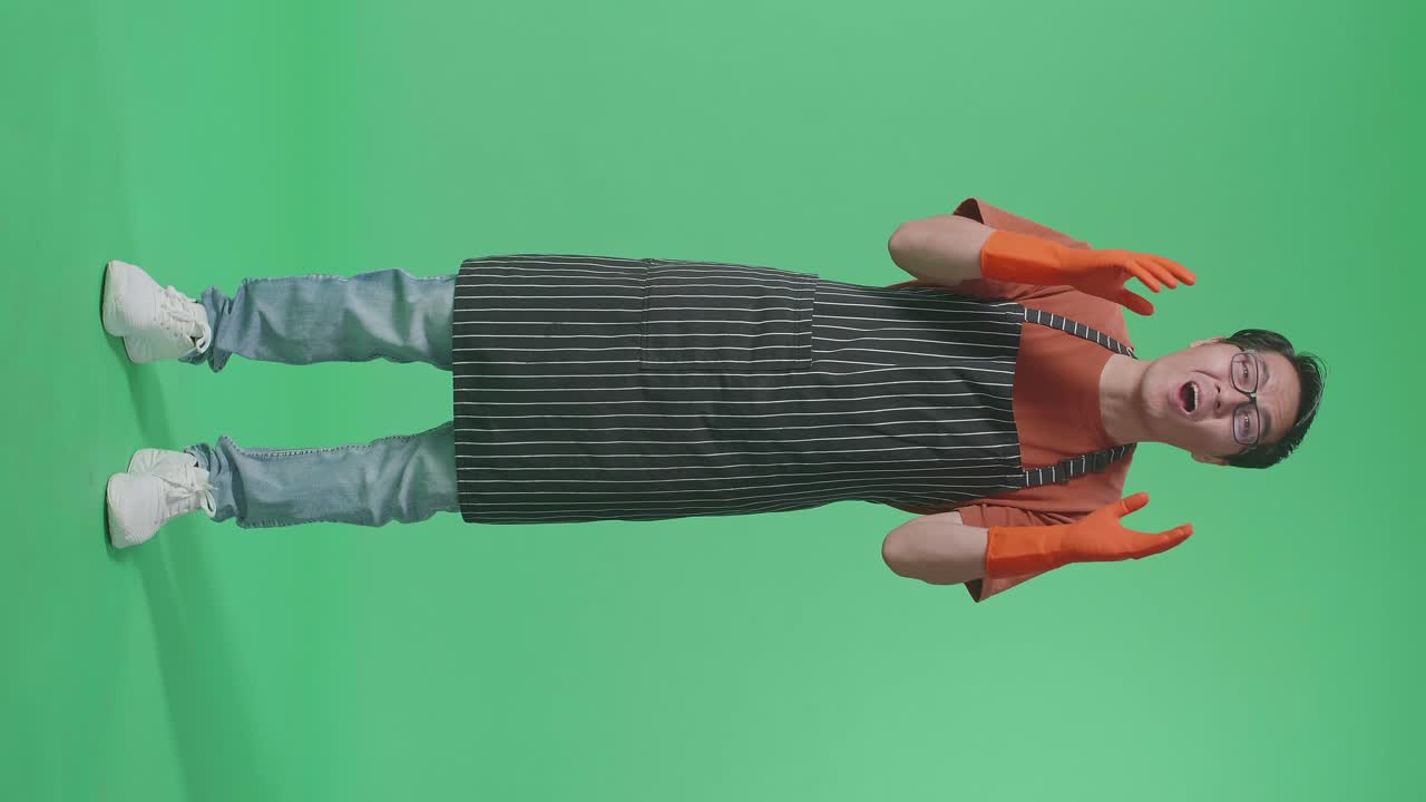 Man in Apron and Gloves, Excited Expression