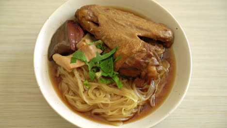 braised duck noodles with brown soup - asian food