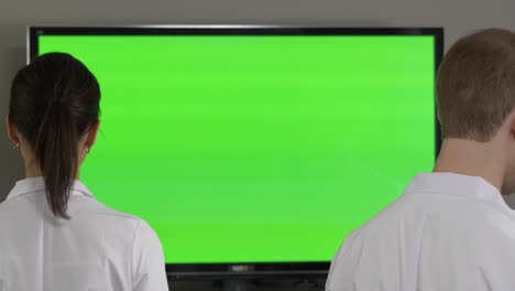 doctors watching a green screen presentation