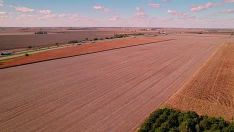 orbiting aerial following a semi truck driver cab on i-57 interstate near illini prairie rest stop northbound above crop fields