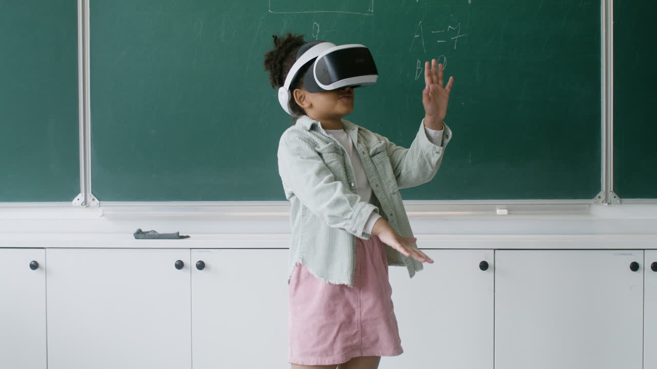 Little girl playing with VR glasses.