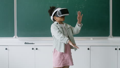 little girl playing with vr glasses.