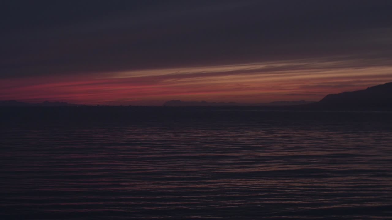 riceland, reykjavik harbour landscape - seascape during sunset and shortly after, dark moody atmosphere