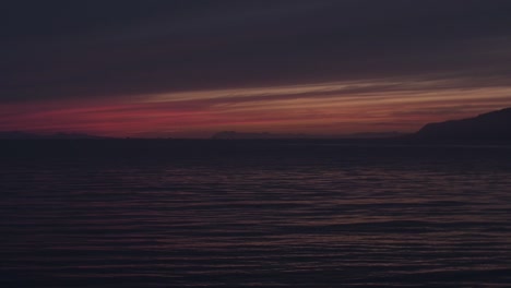 riceland, reykjavik harbour landscape - seascape during sunset and shortly after, dark moody atmosphere