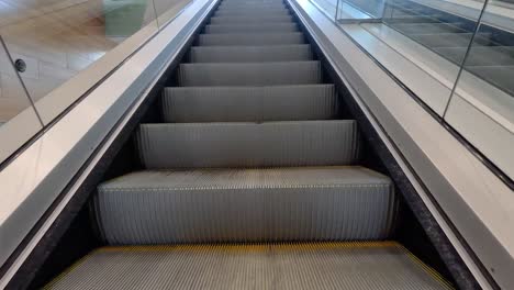 view of an escalator moving upwards