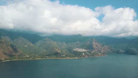 drone aerial view of beautiful lake atitlan during sunny day in guatemala