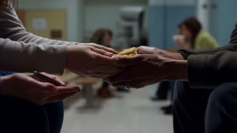 giving food to someone in a waiting room