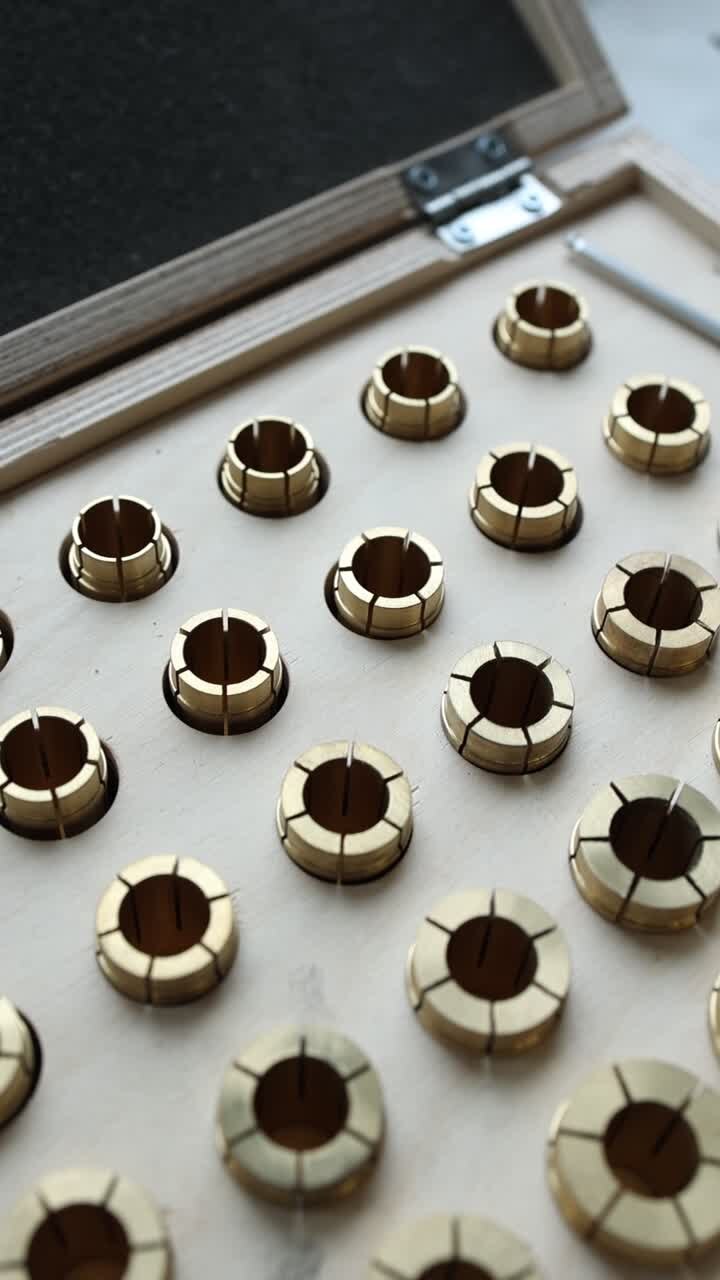 Precision Brass Collets Neatly Arranged in a Wooden Tray