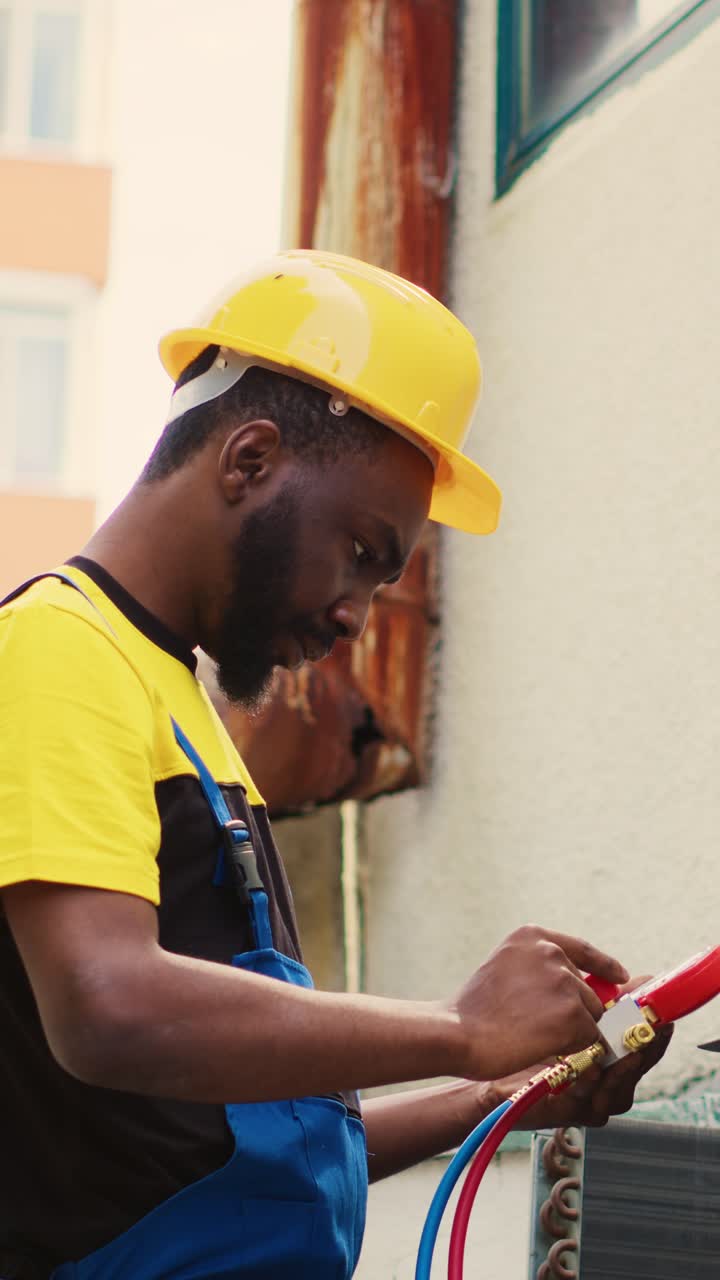 Vertical video Technician looking at freon levels