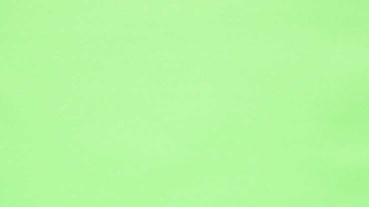 Green crumpled paper unfolds on orange in a stop motion transition
