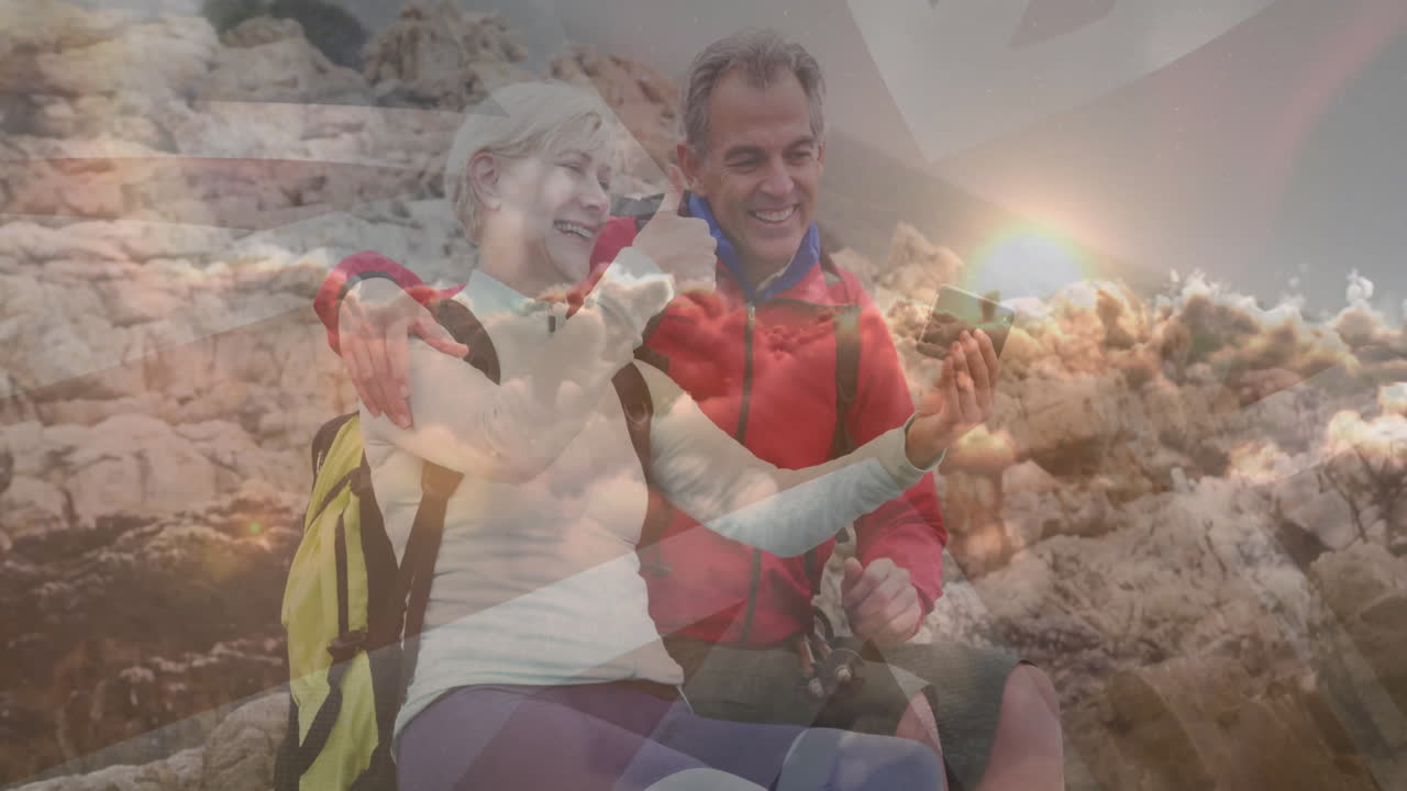 Man hiker and woman taking smartphone selfie on rocky coast, featuring technology icons map overlay