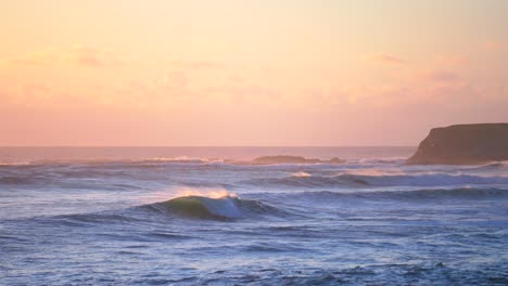 sunset pink golden huge surf waves swell point arena cove northern california fall winter cold pacific ocean point break wind dusk fishing pier mendocino county fort bragg static shot