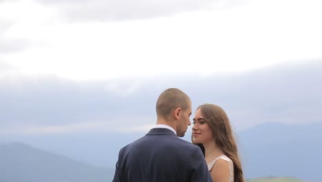 Happy Bride and Groom Kissing in a Beautiful Outdoor Wedding Setting a Joyful Bride and Groom Kissing in a Sunlit Field Sharing Smiles and Laughter as they Celebrate their Special Day in a Picturesque Outdoor Setting Surrounded by Nature