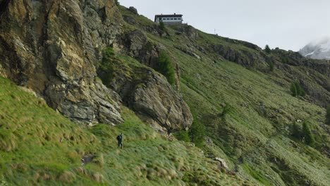 -Valmalenco,-Italy---A-Man-Hiking-Along-a-Trail-in-Fellaria-Valley---Wide-Shot