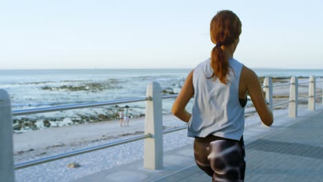 Woman-jogging-near-beach-4k