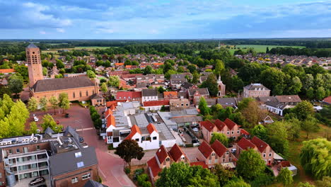 footage over the beautiful rural area with cozy houses. picturesque vierlingsbeek, netherlands from drone