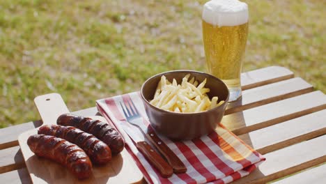 Three-tasty-smoked-grilled-sausages-with-chips