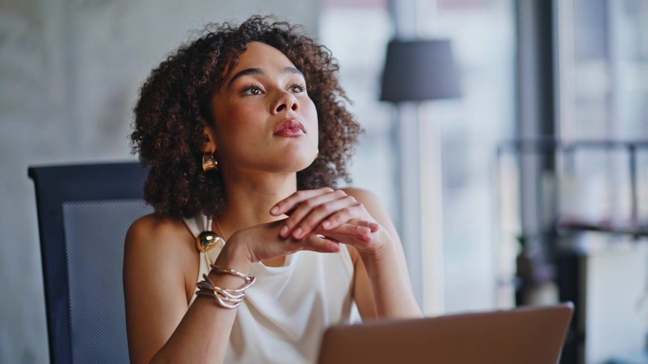 Businesswoman working laptop thinking office. Closeup portrait pensive face.