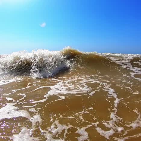 boy jumping in sea waves