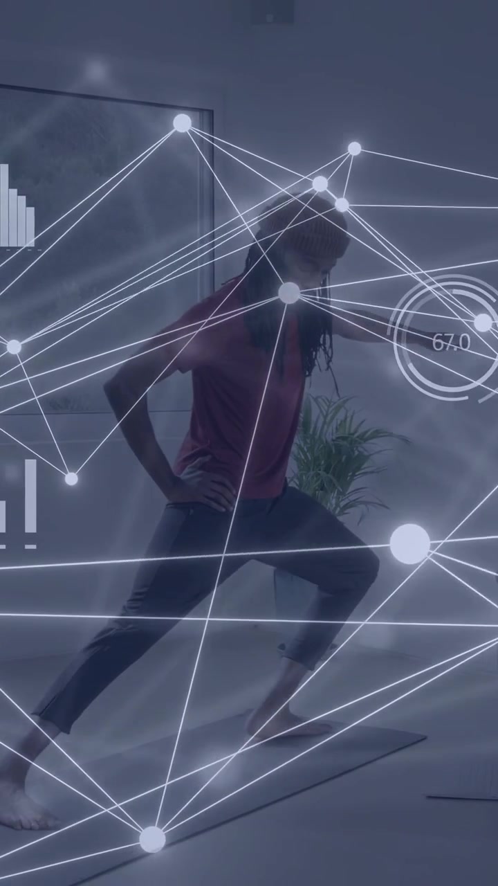 Vertical video: Man stepping into wide lunge on mat shifting pose as nodes overlaying body tracking