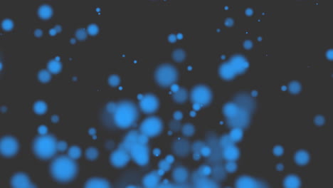 partículas redondas azules voladoras con brillos en degradado negro de moda