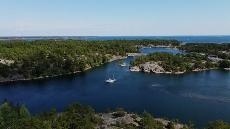 drone footage reveals untouched nature and yacht floating in stockholm’s islands