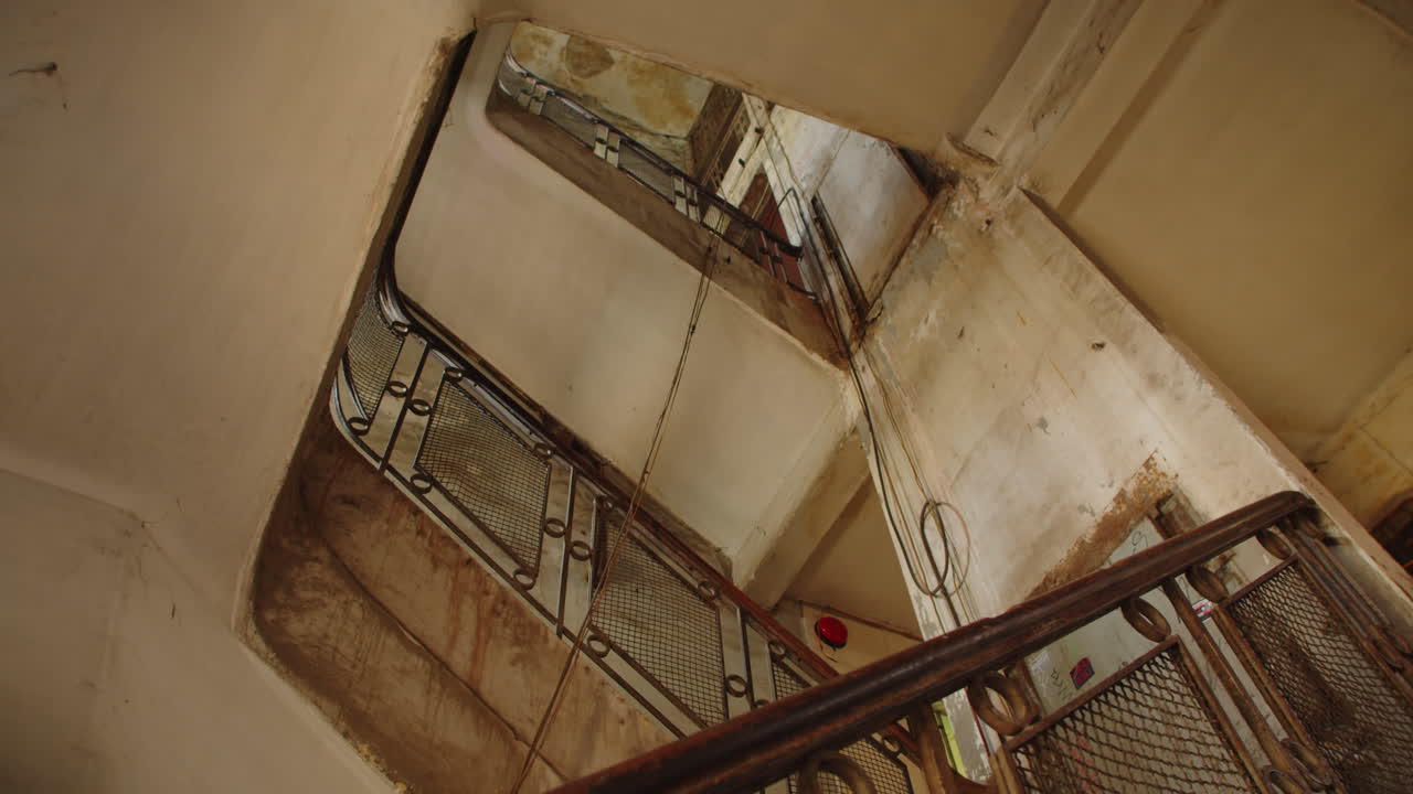 Stairwell with Old Banister inside Shabby Building