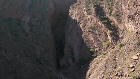 Aerial-rising-from-rock-formation,-Devils-Throat,-Salta,-Argentina