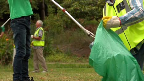 happy family collecting rubbish