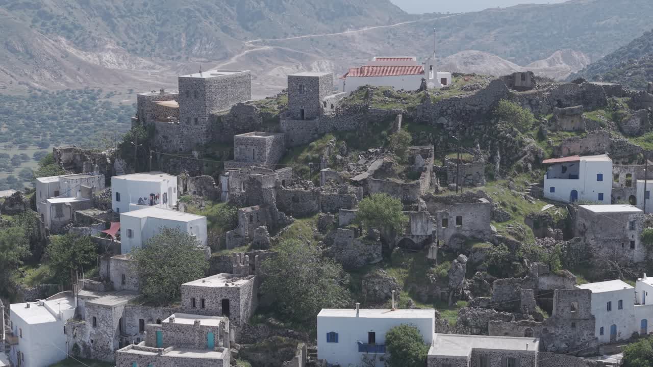 Bird's eye view revealing the beauty of Panoramic view of the active volcano and the village of Emporeios in Nisyros island, Greece. D-log M