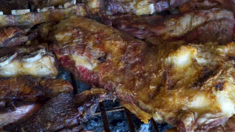 close up shot of delicious argentinian meat cooking in an asado